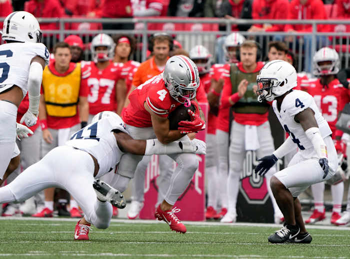 Former Ohio State receiver Julian Fleming catches a pass against Penn State at Ohio Stadium in 2023. Fleming will play for the Nittany Lions in 2024.